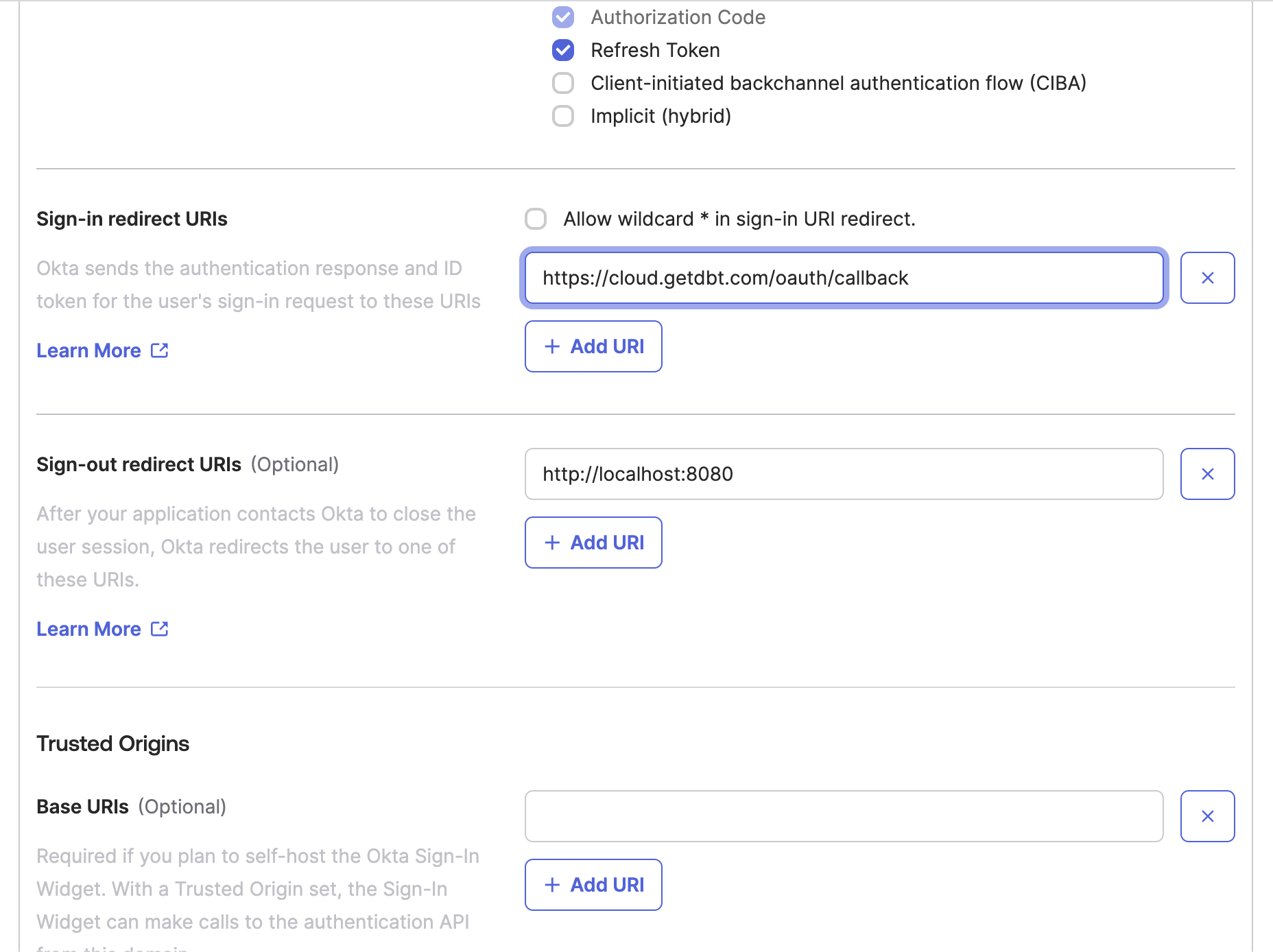 The Okta app configuration window with the sign-in redirect URI configured to the dbt Cloud value.